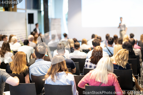 Image of Business speaker giving a talk at business conference event.