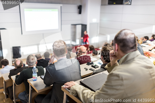 Image of Business speaker giving a talk at business conference event.