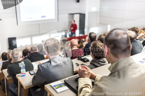 Image of Business speaker giving a talk at business conference event.