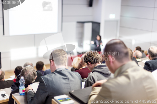 Image of Business speaker giving a talk at business conference event.
