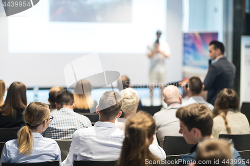 Image of Business speaker giving a talk at business conference event.