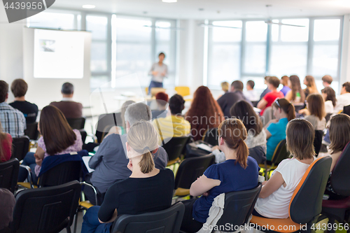 Image of Speaker giving presentation talk on business conference.