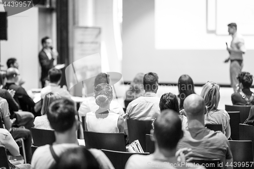 Image of Business speaker giving a talk at business conference event.