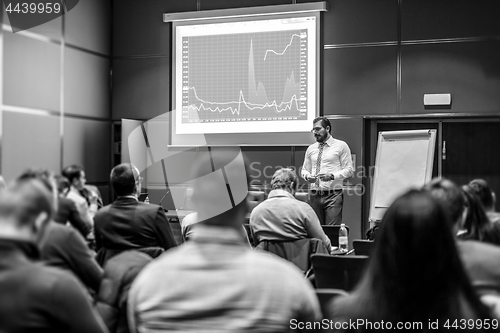 Image of Skiled Public Speaker Giving a Talk at Business Meeting.