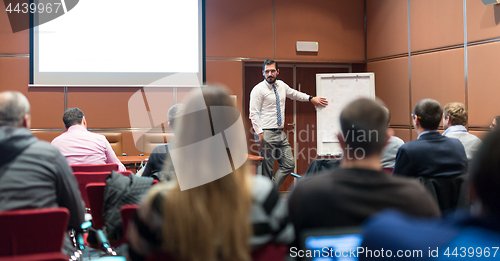 Image of Speaker Giving a Talk at Business Meeting.