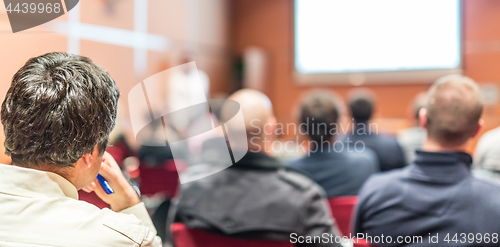 Image of Audience in conference hall listening to presentation on business conference.