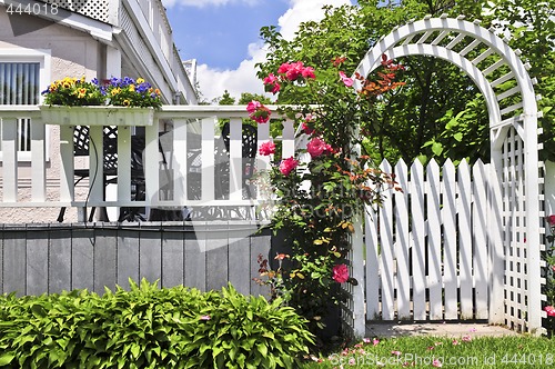 Image of White arbor in a garden