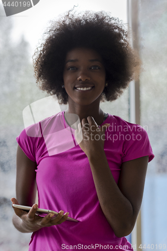 Image of african american woman using tablet