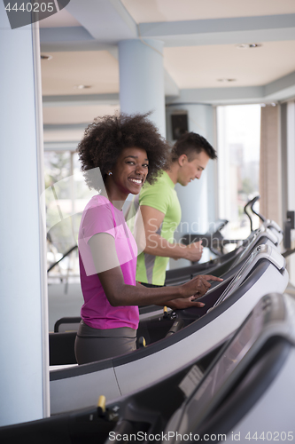 Image of people exercisinng a cardio on treadmill in gym