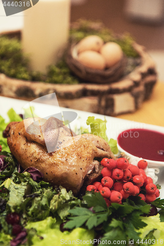 Image of quail roasted with sweet and sour cranberry sauce