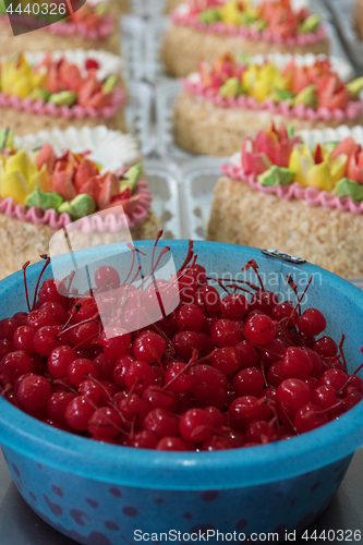 Image of Bowl of cherry on cake production