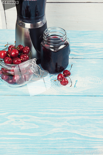 Image of Cherry juice with glass of berries