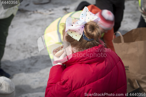 Image of Girl eating Hot dog