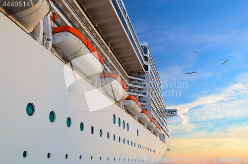 Image of Luxury passenger ship cruise liner at sunrise