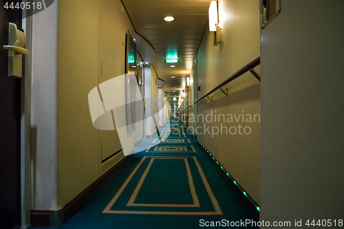 Image of Passenger deck hallway with living cabins rooms on board of crui