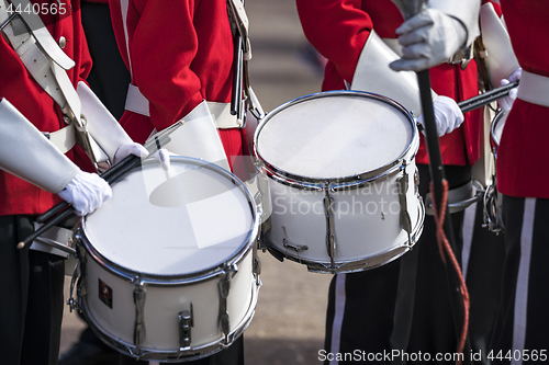 Image of Soldiers in red uniforms with drums