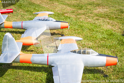 Image of Model planes on a green field in the summer