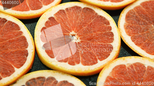 Image of Composed slices of red grapefruit