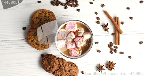 Image of Mug of cacao with marshmallows and cookies