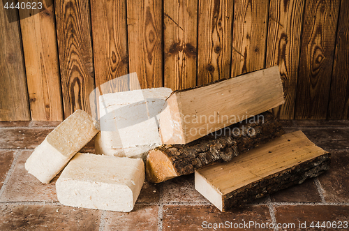 Image of Wood briquette and firewood, close-up