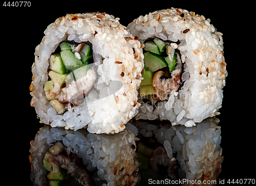 Image of Closeup two sushi rolls california