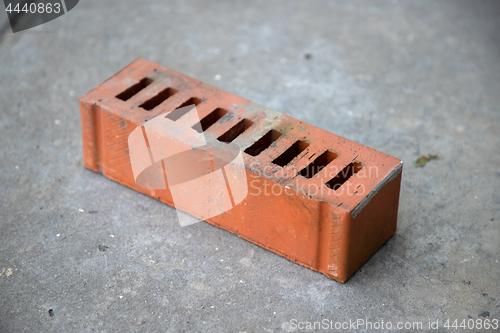 Image of old brick on grey concrete background