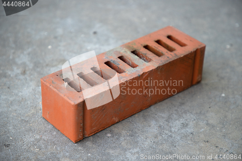 Image of old brick on grey concrete background