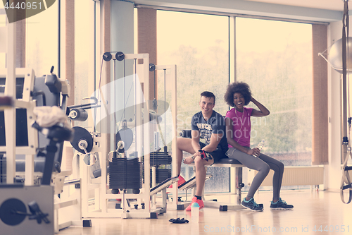 Image of couple in a gym have break