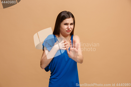 Image of Disgust woman with thoughtful expression making choice against pastel background