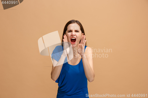 Image of Isolated on pastel young casual woman shouting at studio