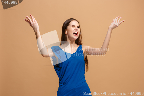 Image of Portrait of an argue woman looking at camera isolated on a pastel background