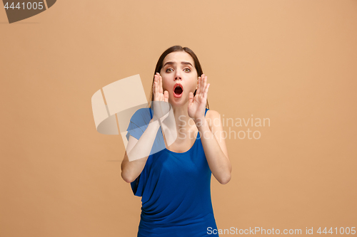 Image of Isolated on pastel young casual woman shouting at studio