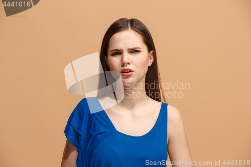 Image of Disgust woman with thoughtful expression making choice against pastel background