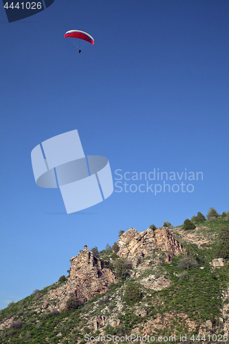 Image of Parasailing in a blue sky