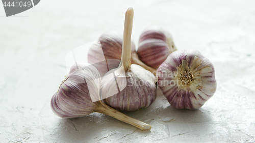 Image of Heap of unpeeled garlic bulbs