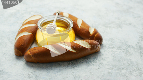 Image of Baguettes with jar of honey
