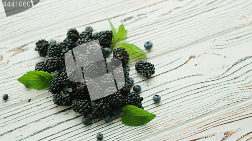 Image of Heap of blackberry with mint leaves