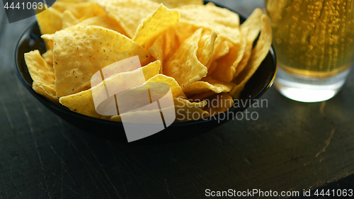 Image of Plate with nachos and beer 