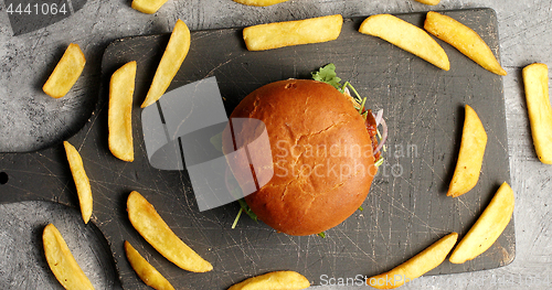 Image of Composition of burger with fries