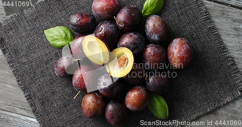 Image of Served ripe plums on napkin