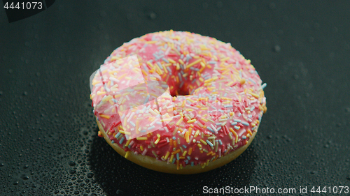 Image of Pink donut with sprinkles 