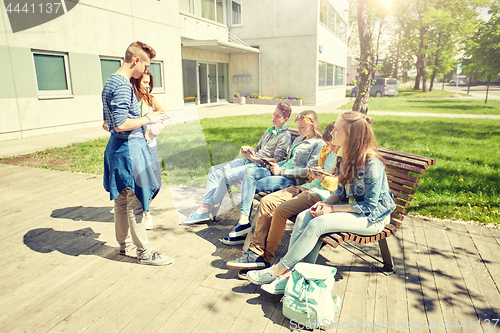 Image of teenage students with tablet pc at school yard