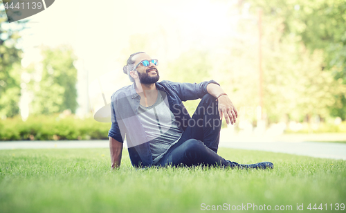 Image of man in sunglasses at city street or park