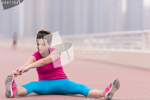 Image of woman stretching and warming up