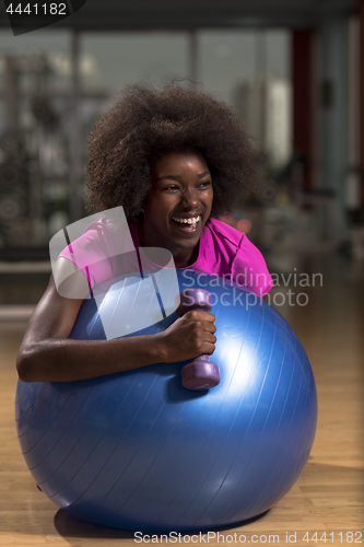 Image of woman  relaxing after pilates workout