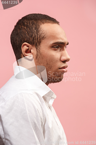 Image of Afro man looking suprised and bewildered isolated on pink