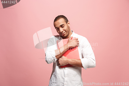 Image of Businessman hugging laptop