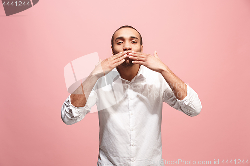 Image of Portrait of attractive man with kiss isolated over pink background