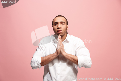 Image of Afro man looking suprised and bewildered isolated on pink