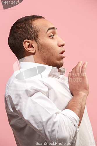 Image of Portrait of the scared man on pink